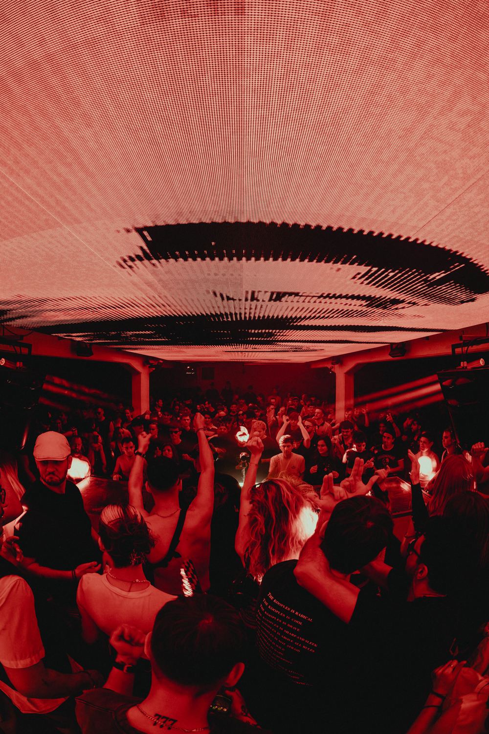 Hands up under the light ceiling